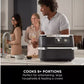 Ninja AF500UK FlexDrawer showing two independent 5.2L cooking zones with divider insert installed